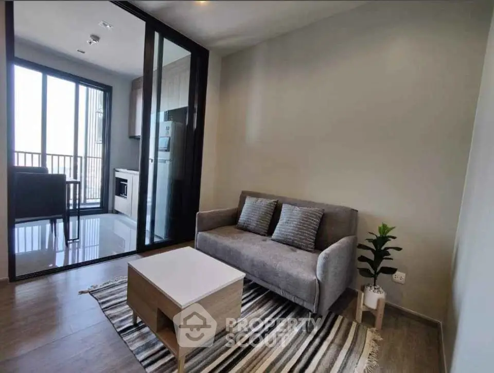 Modern living room with cozy sofa and stylish decor in a contemporary apartment.