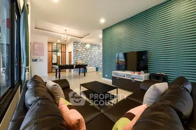 Spacious living room with modern decor and entertainment setup