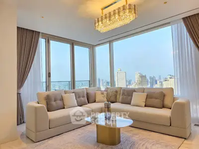 Luxurious living room with panoramic city view and elegant chandelier