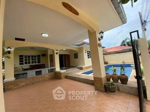 Charming home with inviting pool and spacious patio, perfect for outdoor relaxation.