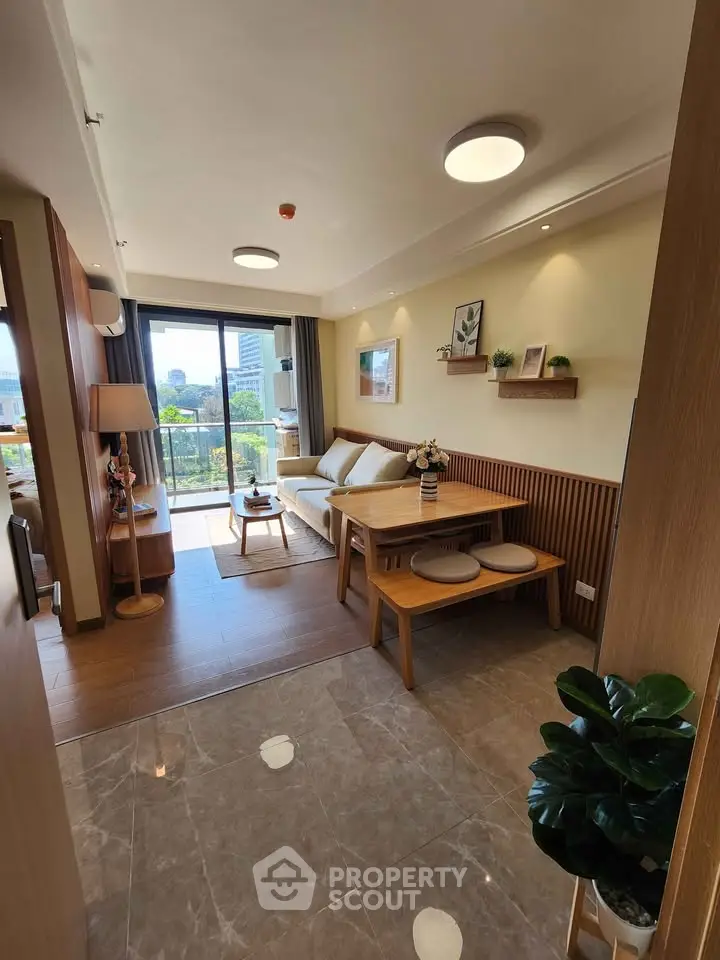 Modern living room with natural light and stylish wooden furniture