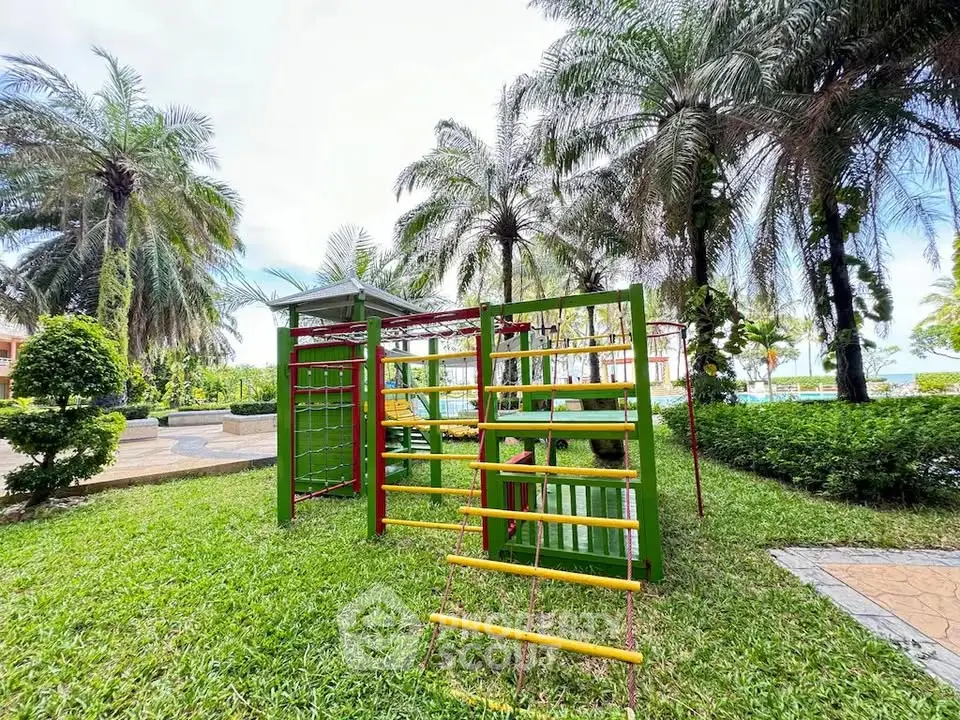 Lush garden with playground equipment and palm trees in a serene residential area.