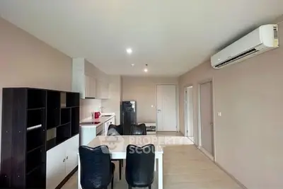 Spacious modern living room with dining area and air conditioning