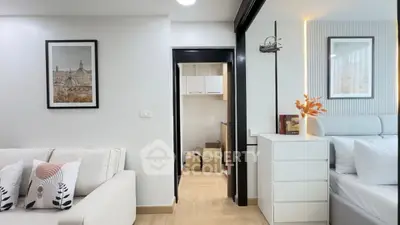 Modern living room with elegant decor and cozy bedroom view