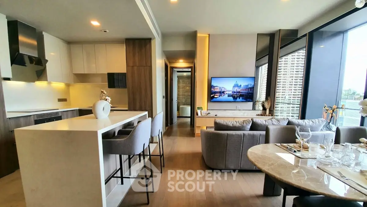Luxurious modern living room with open kitchen and stunning city view, perfect for urban living.