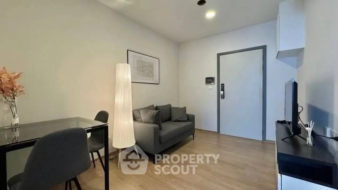 Modern living room with sleek furniture and stylish decor, perfect for urban living.