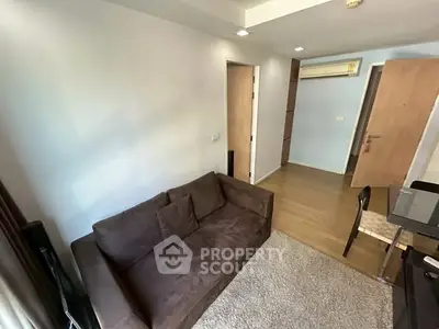 Cozy living room with brown sofa and modern decor