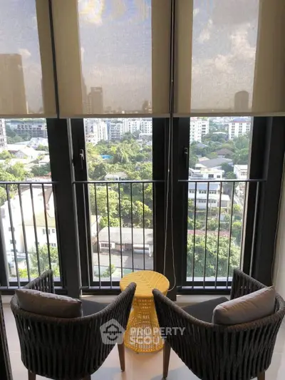 Chic balcony with stunning city view, perfect for relaxation and enjoying the skyline.