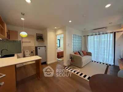 Modern open-plan living room with kitchen and cozy decor