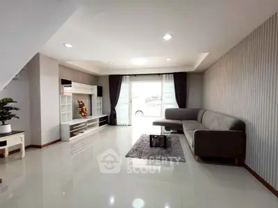 Spacious modern living room with sleek furniture and natural light