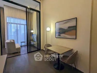 Modern living room with stylish decor and floor-to-ceiling windows
