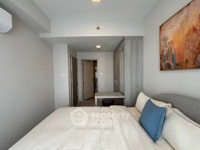 Modern bedroom with stylish decor and cozy ambiance in a contemporary apartment.