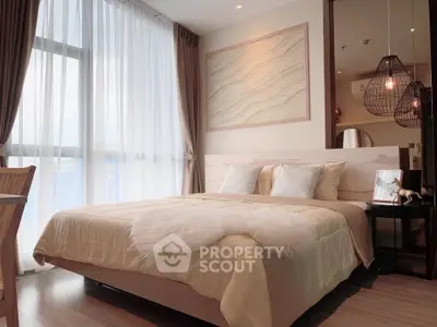 Luxurious bedroom with large window and elegant decor in modern apartment