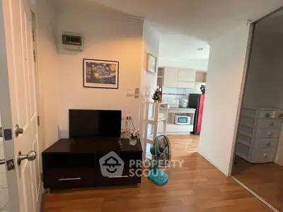 Charming apartment interior with cozy living area and modern kitchen, perfect for urban living.