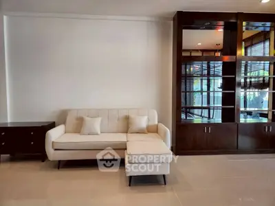 Modern living room with elegant sofa and stylish wooden cabinet