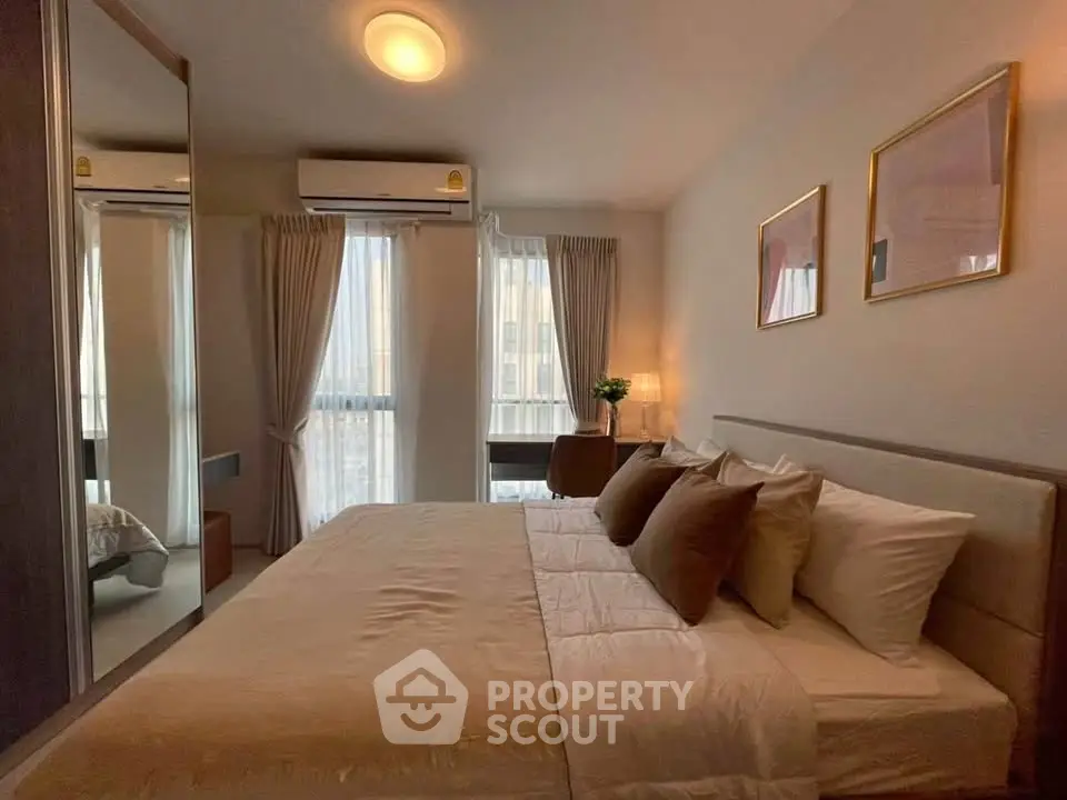 Cozy bedroom with elegant decor and natural light, featuring a comfortable bed and stylish furnishings.