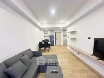 Modern living room with sleek furniture and open layout, perfect for contemporary living.