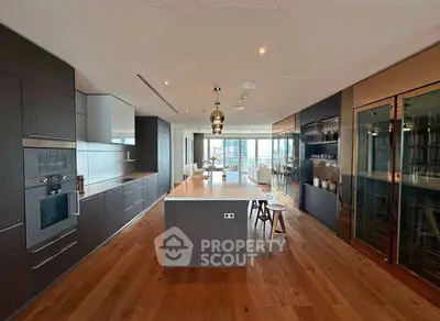 Luxurious modern kitchen with open layout and stunning city view