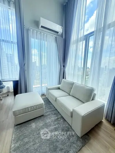 Luxurious high-rise living room with floor-to-ceiling windows and stunning city views.
