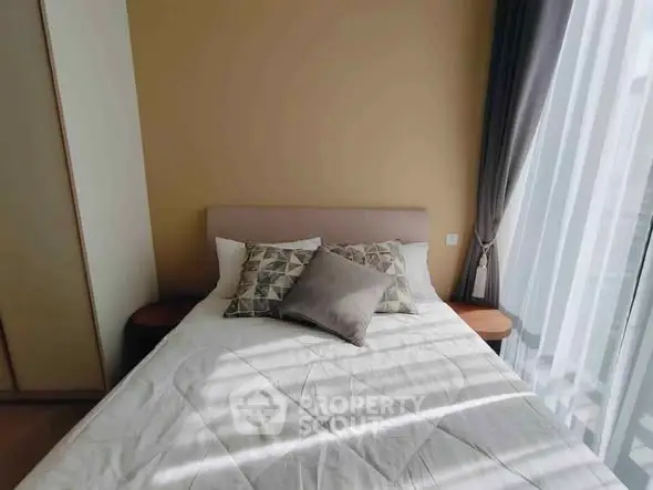 Cozy bedroom with natural light and stylish decor