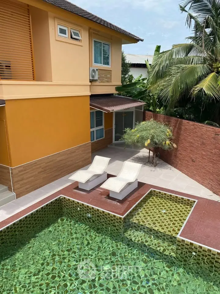 Stunning tropical villa with private pool and lush garden, perfect for luxurious living and relaxation.