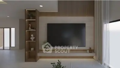 Modern living room with large TV and elegant decor
