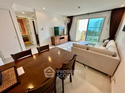 Spacious living room with modern furniture and balcony view in a stylish apartment.