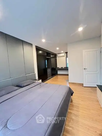 Modern bedroom with sleek design and ample storage space