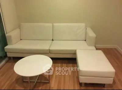 Modern living room with white sofa and minimalist decor