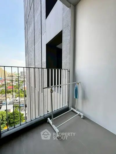 Modern balcony with city view and minimalist railing