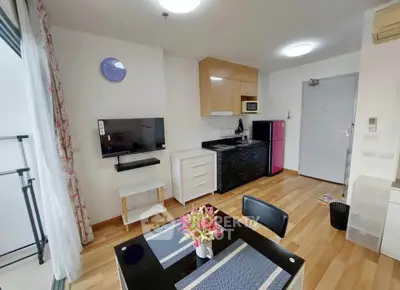 Charming studio apartment with modern kitchen and cozy dining area, perfect for urban living.