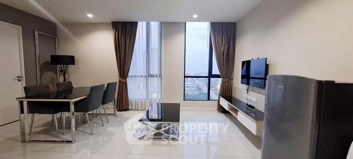 Modern living room with city view, sleek furniture, and elegant decor
