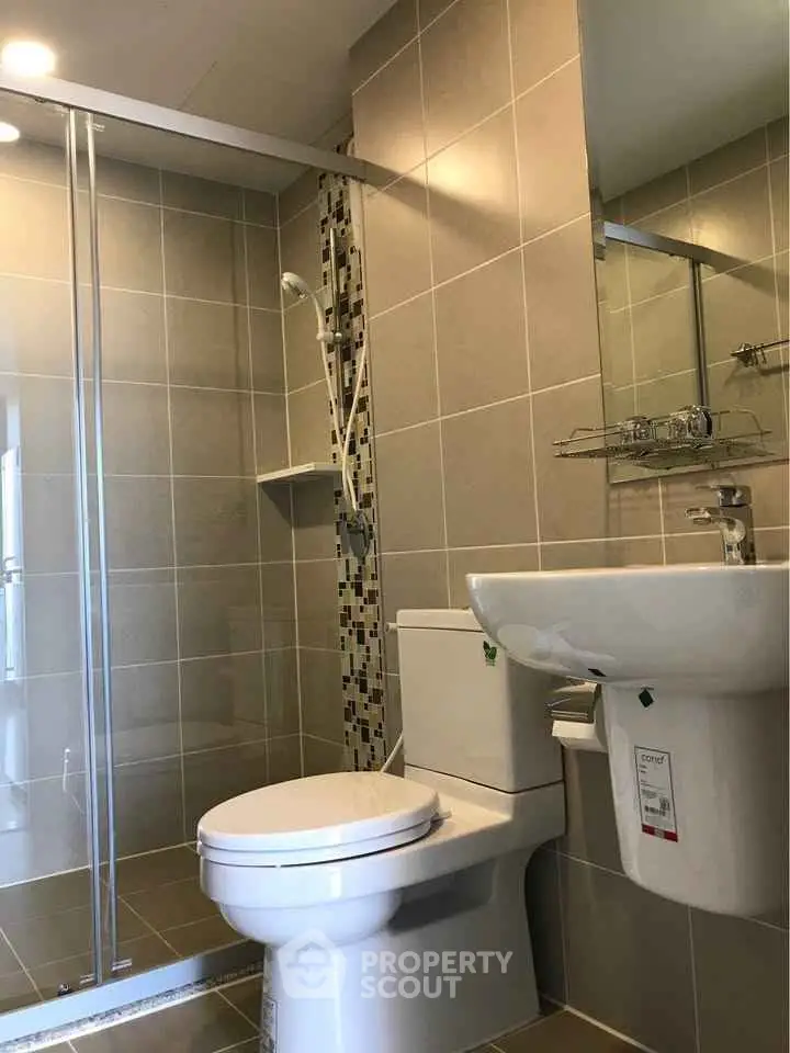 Modern bathroom with glass shower and sleek fixtures