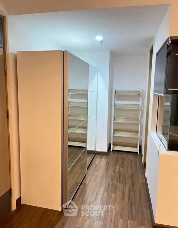 Spacious storage area with modern shelving and wooden flooring
