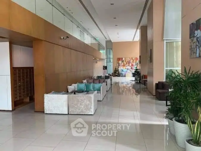 Luxurious modern lobby with elegant seating and contemporary art, perfect for welcoming guests in style.