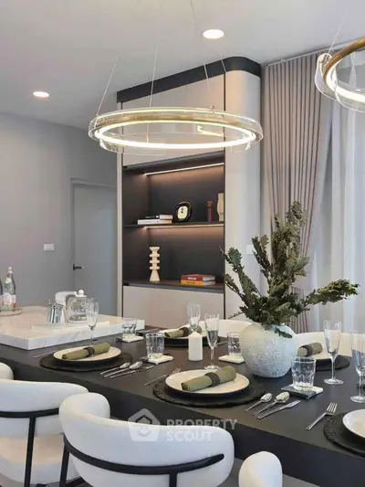 Elegant dining room with modern decor and stylish lighting, perfect for entertaining guests.