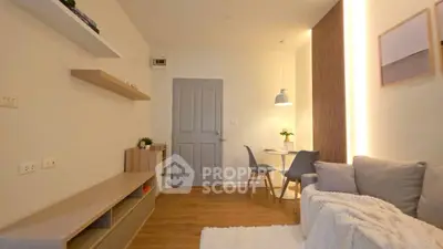 Cozy living room with modern decor and dining area