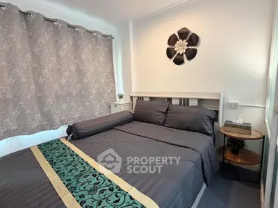 Cozy bedroom with elegant decor and stylish bedding in a modern apartment.
