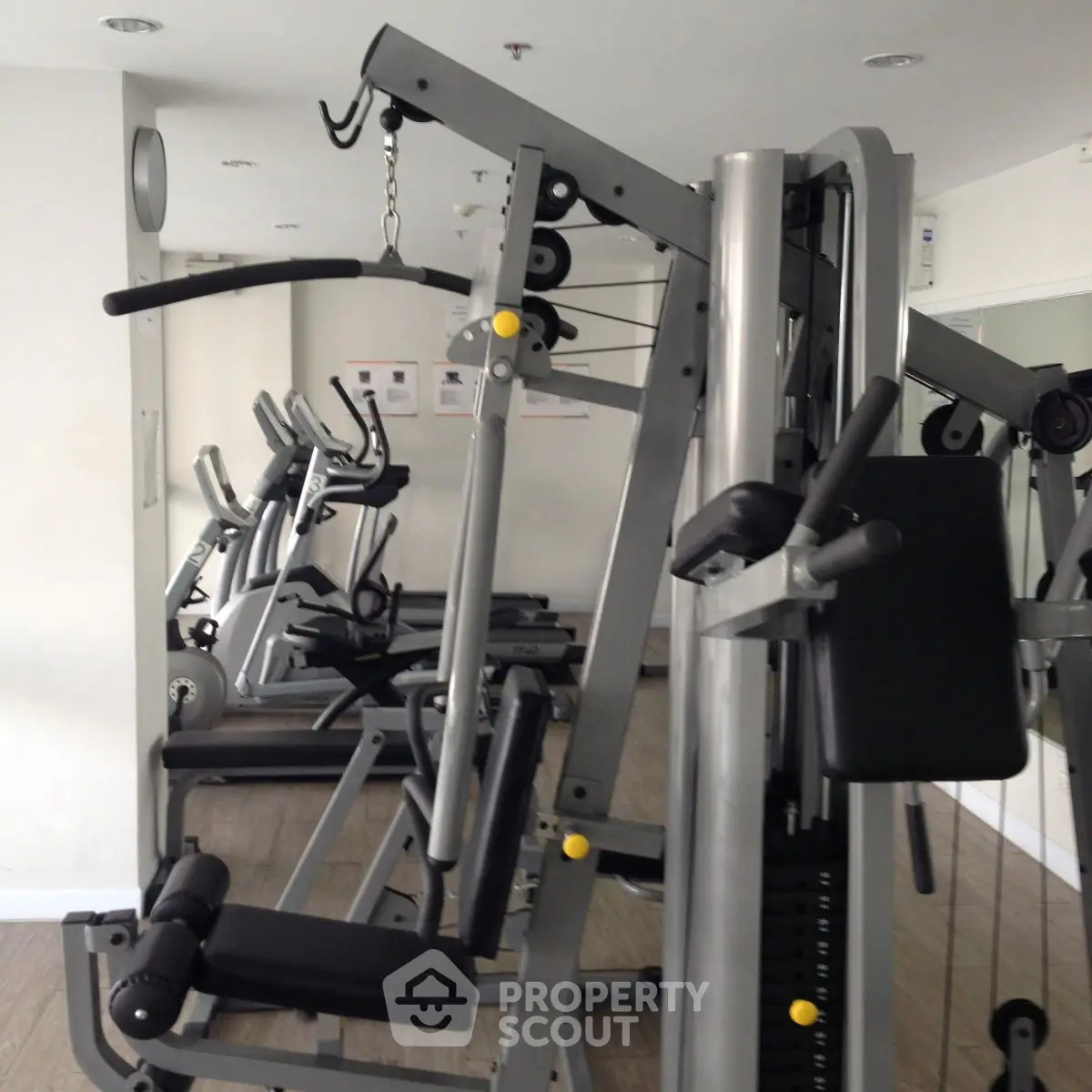 Modern gym with state-of-the-art fitness equipment in a residential building.