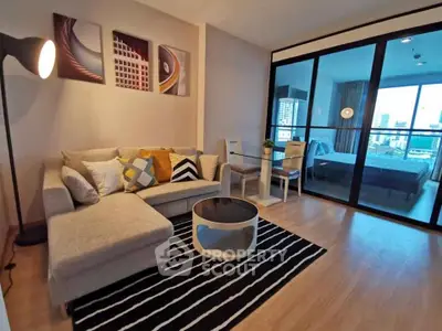 Modern living room with stylish decor and city view from balcony