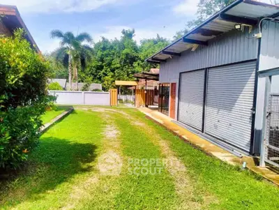 Spacious property with lush green lawn and modern exterior, perfect for serene living.