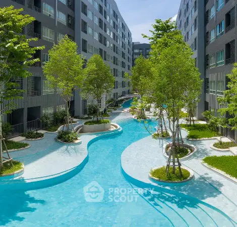 Luxurious apartment complex with stunning pool and lush landscaping
