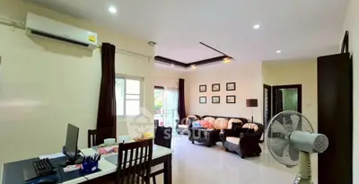 Spacious living room with modern decor and natural light