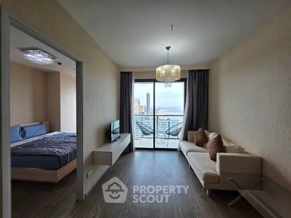 Modern living room with balcony view in high-rise apartment