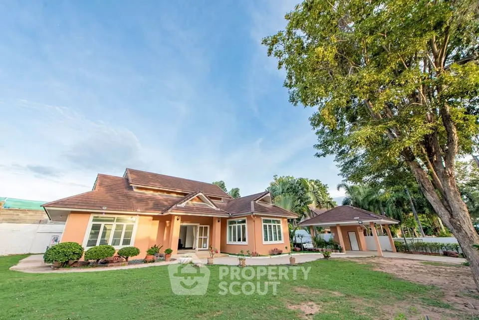 Charming single-story home with spacious garden and lush greenery, perfect for family living.