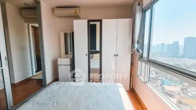 Bright bedroom with city view and modern furnishings