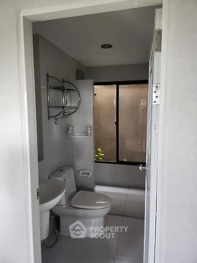 Modern bathroom with sleek design and large window for natural light