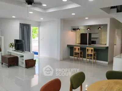 Spacious modern living room with open layout and stylish furniture, perfect for entertaining.