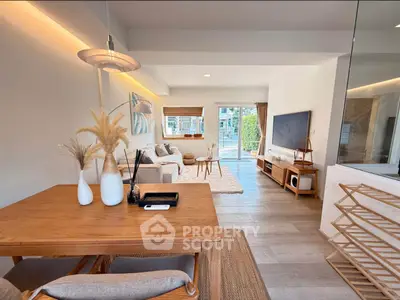 Modern open-plan living room with stylish decor and natural light