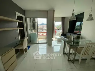 Modern living room with glass dining table and city view balcony